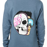 FEMALE MODEL WEARING A BLUE HOODIE WITH THE HOOD UP, FEATURING A GRAPHIC OF A CARTOON HALF SKELETON HALF SKIER HEAD WITH THE WORDS 'TILL I DIE'