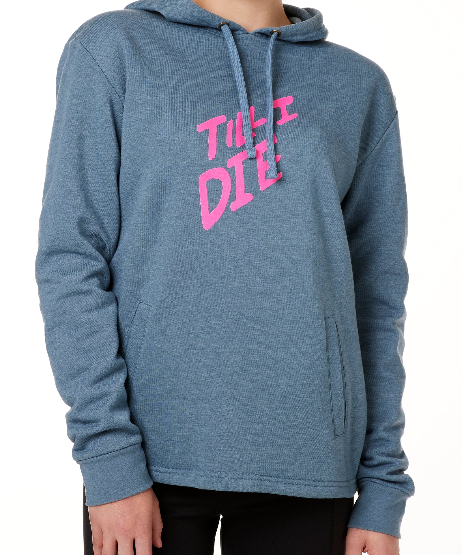 A female model wearing a BLUE hoodie with the text 'TILL I DIE' printed in pink on the front.