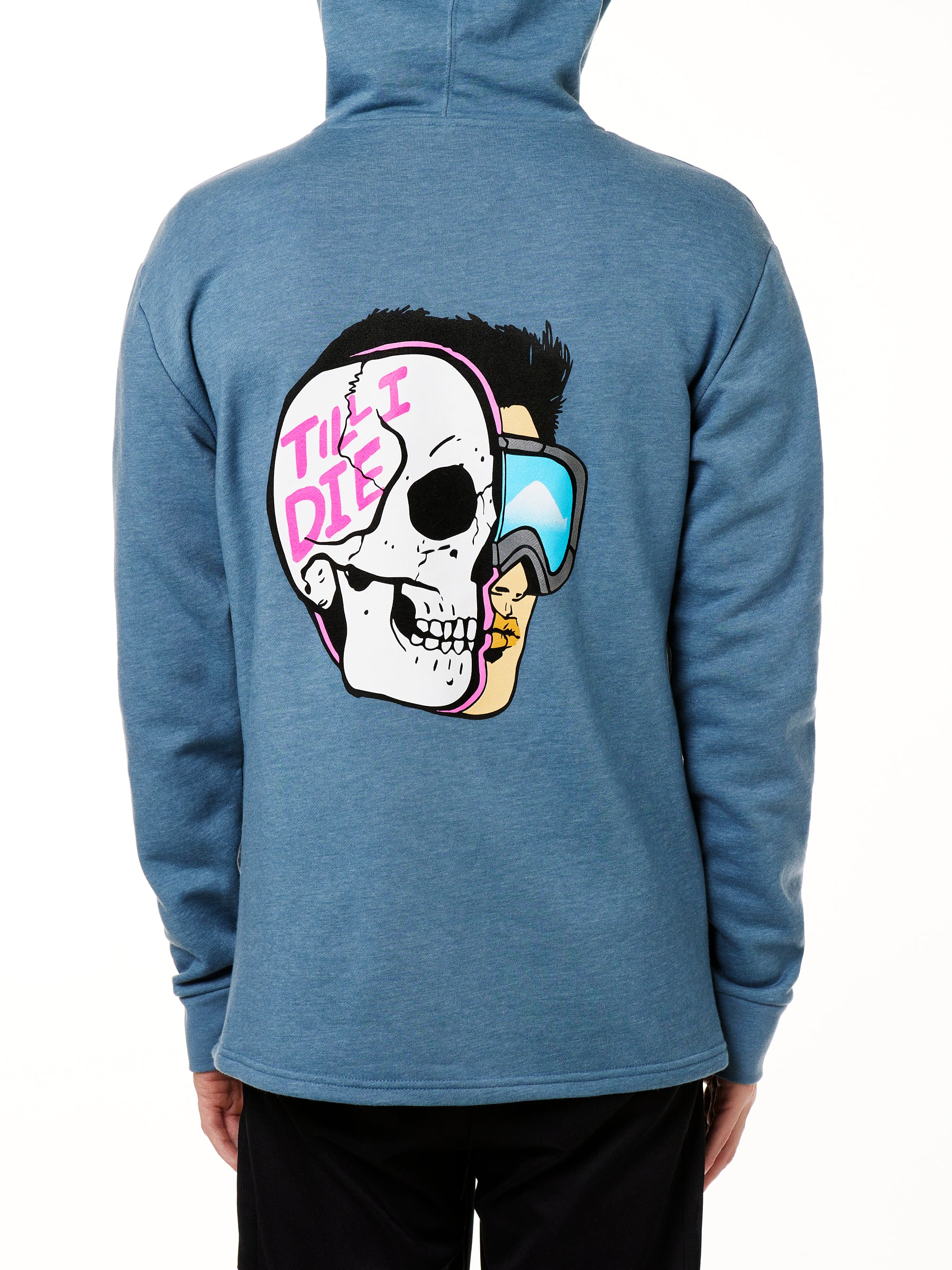 MALE MODEL WEARING A BLUE HOODIE WITH THE HOOD UP, FEATURING A GRAPHIC OF A CARTOON HALF SKELETON HALF SKIER HEAD WITH THE WORDS 'TILL I DIE'