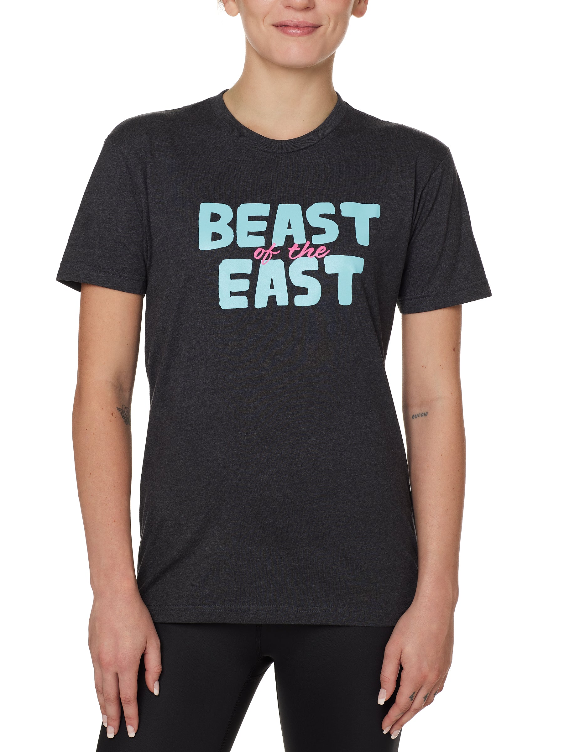 FEMALE MODEL WEARING A HEATHER GRAY TEE SHIRT WITH THE WORDS "BEAST OF THE EAST" IN BLUE AND PINK