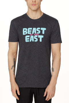MALE MODEL WEARING A HEATHER GRAY TEE SHIRT WITH THE WORDS "BEAST OF THE EAST" IN BLUE AND PINK