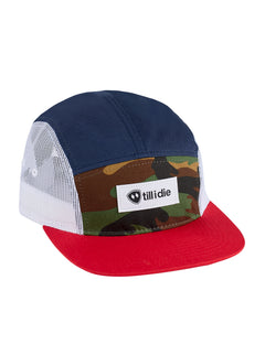 Front view of the Mesh Camp Hat on a white background, featuring a multicolor panel design in camouflage, blue, and white mesh with a red brim. Finished with a horizontal black-and-white 'Till I Die' woven label on the front panel.