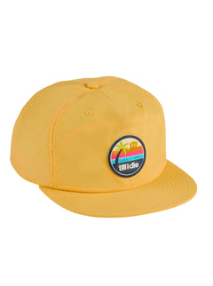 Front view of the Sunset sessions Till I Die marigold-colored surf hat on a white background, featuring a multicolored PVC patch with an ocean sunset and palm tree scene, anchored by “Till I Die” text along the bottom.
