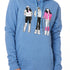 FEMALE MODEL WEARING A HEATHER BLUE HOODIE WITH A GRAPHIC OF THREE 1980S SKI LADIES 