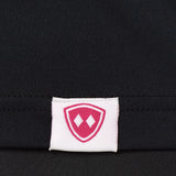 DETAIL OF A BLACK SHIRT WITH A TILL I DIE WOVEN HEM TAG