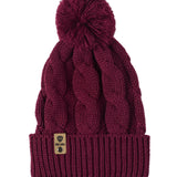 A burgundy cable-knit beanie hat with a matching pom-pom on top and a ribbed cuff featuring a Till I Die Logo leather tab, shown against a plain white background.