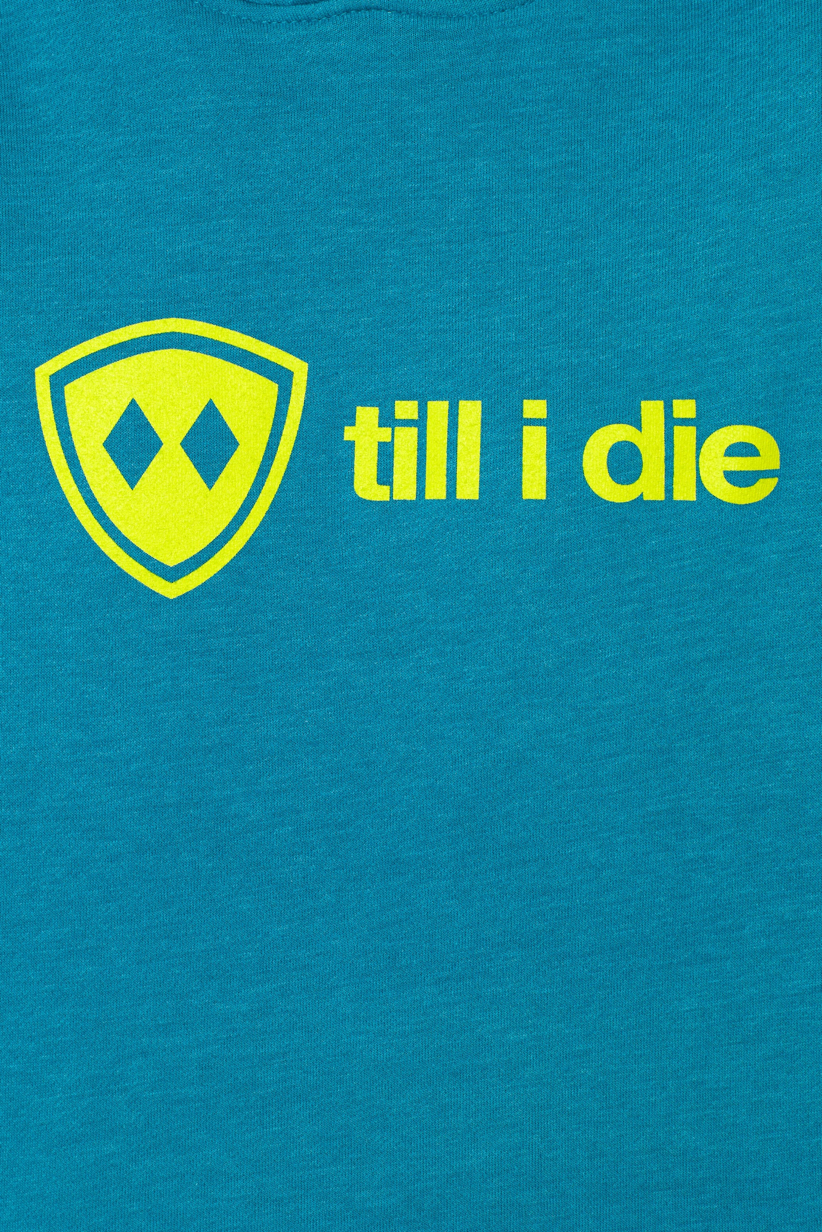 detail view of a bright yellow till i die logo on a heather teal hoodie
