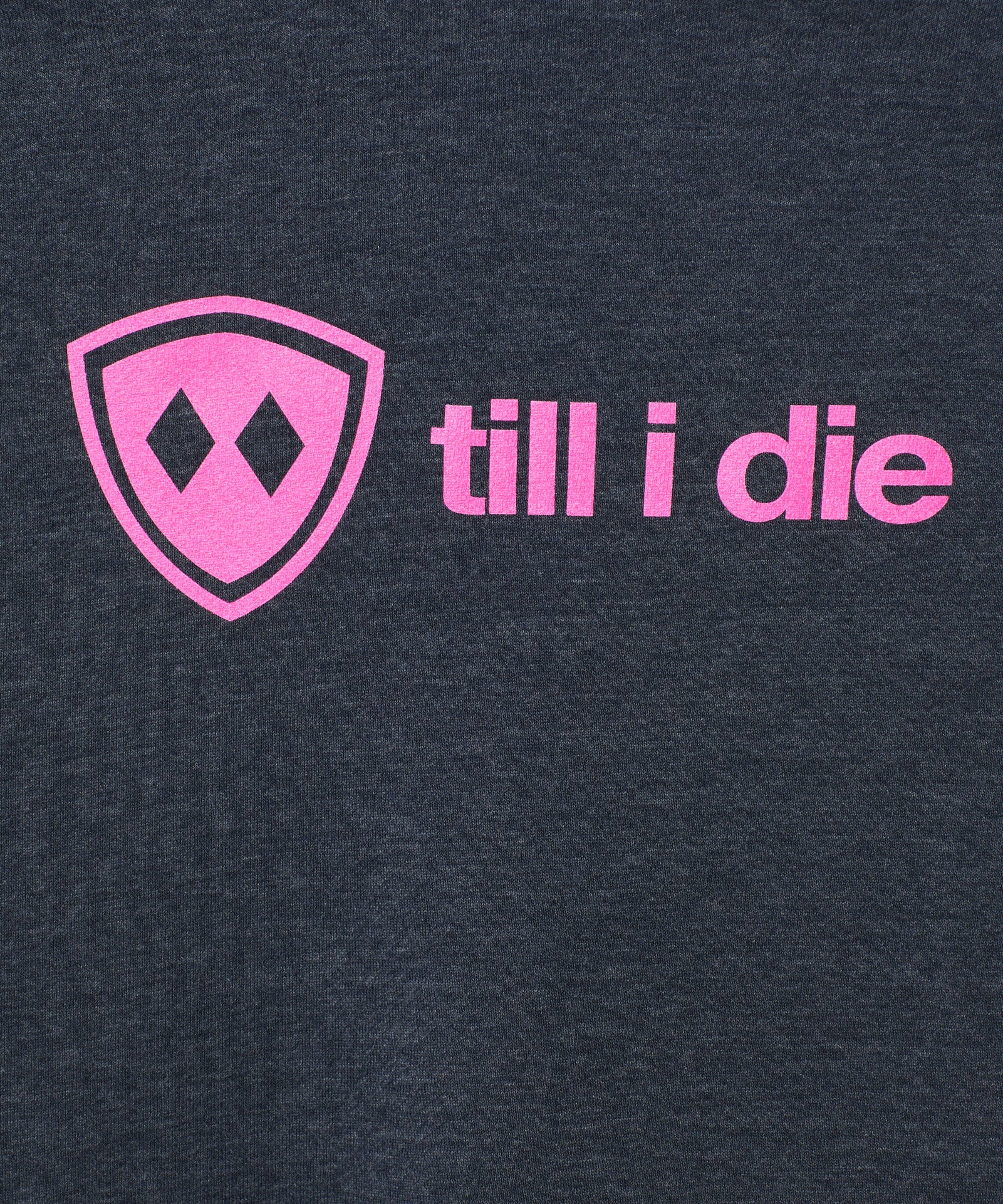 detail view of a bright pink till i die logo on a heather navy hoodie