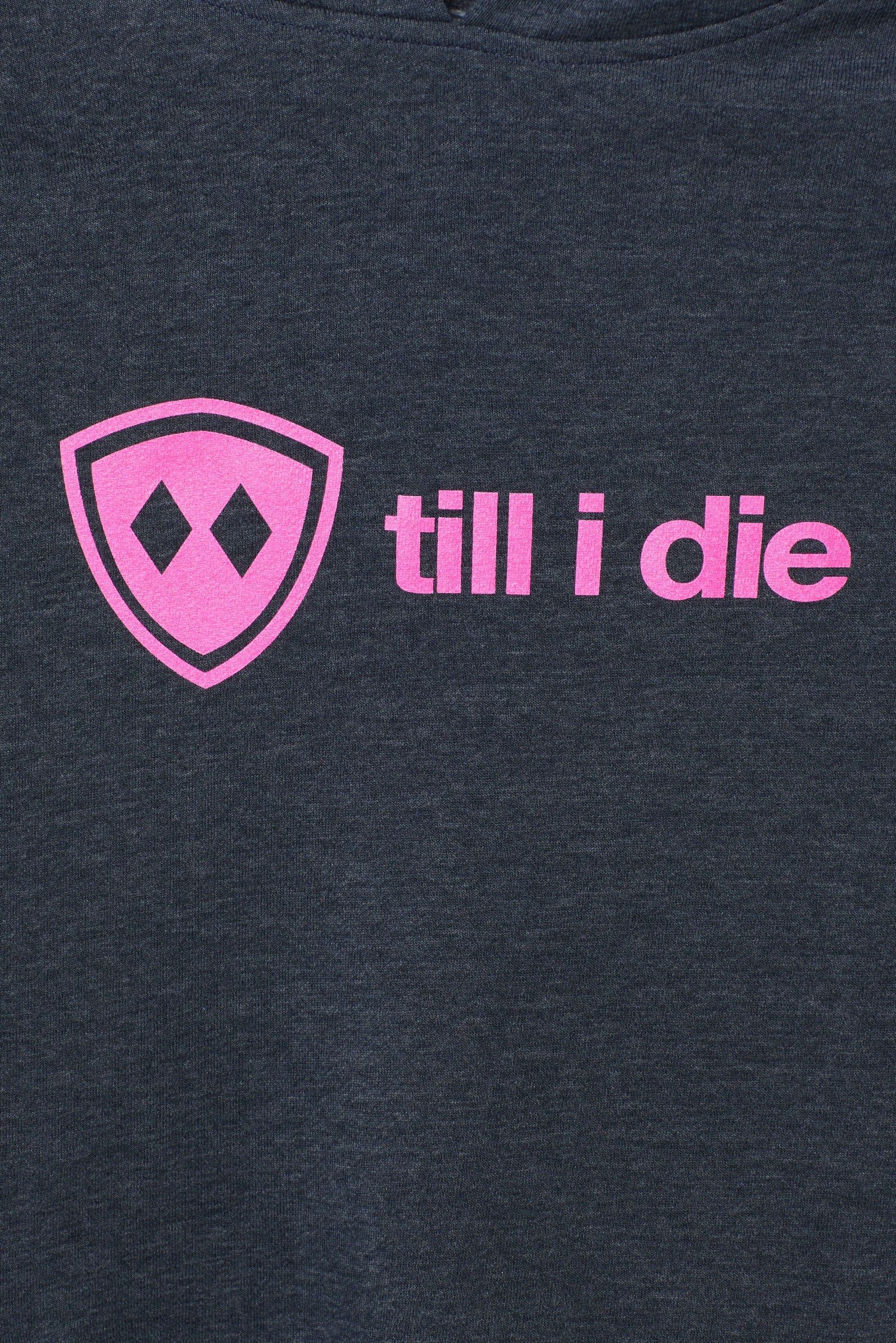 detail view of a bright pink till i die logo on a heather navy hoodie
