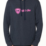 Front view of a male model wearing the Heather Navy Logo Hoodie on a white background. Features a bold bright pink “Till I Die” logo printed across the chest, separated welt front pockets, and dyed-to-match drawstrings.