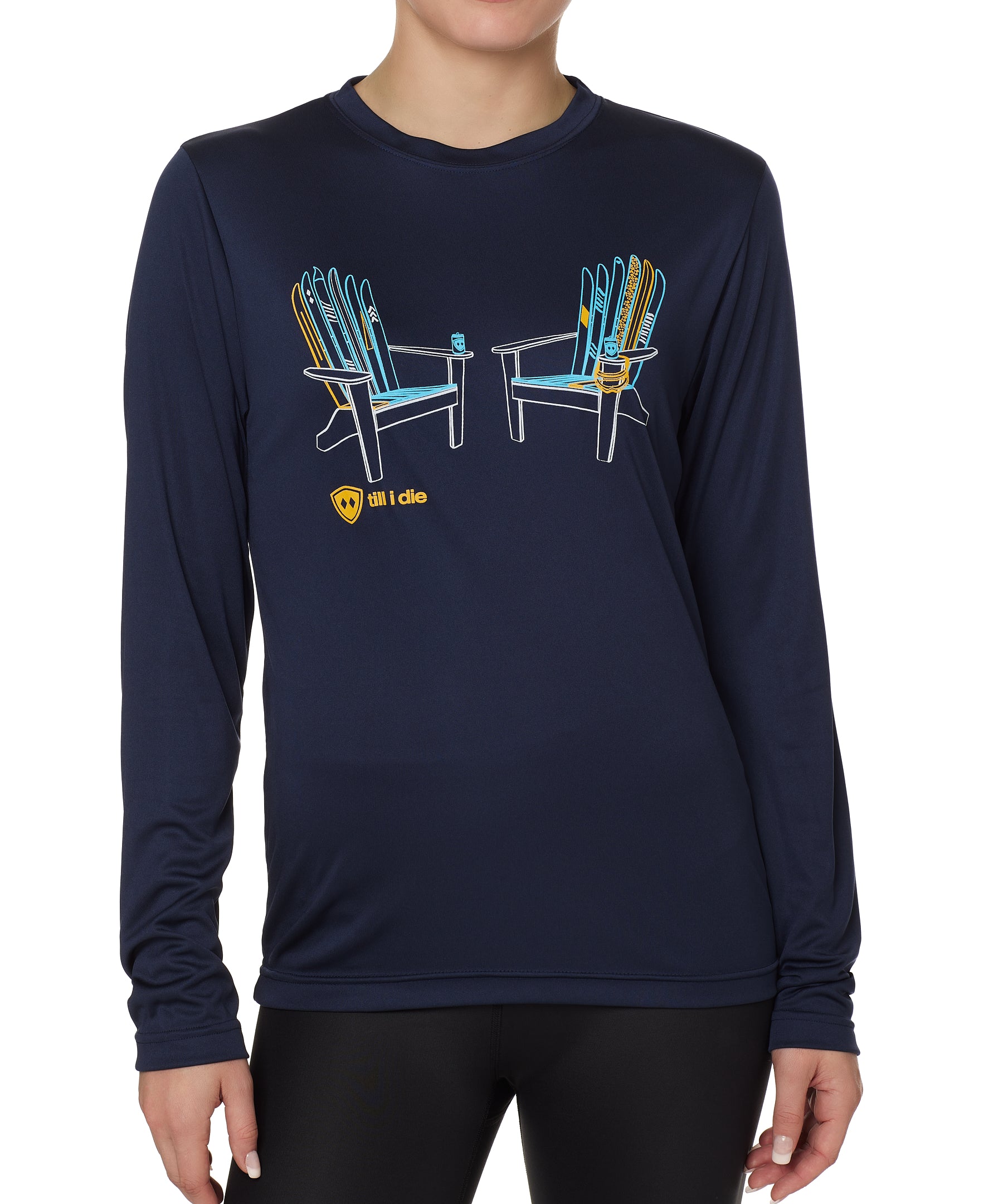 A person wearing a long sleeve navy blue shirt with a graphic of two adirondack chairs MADE OUT OF SKIS.