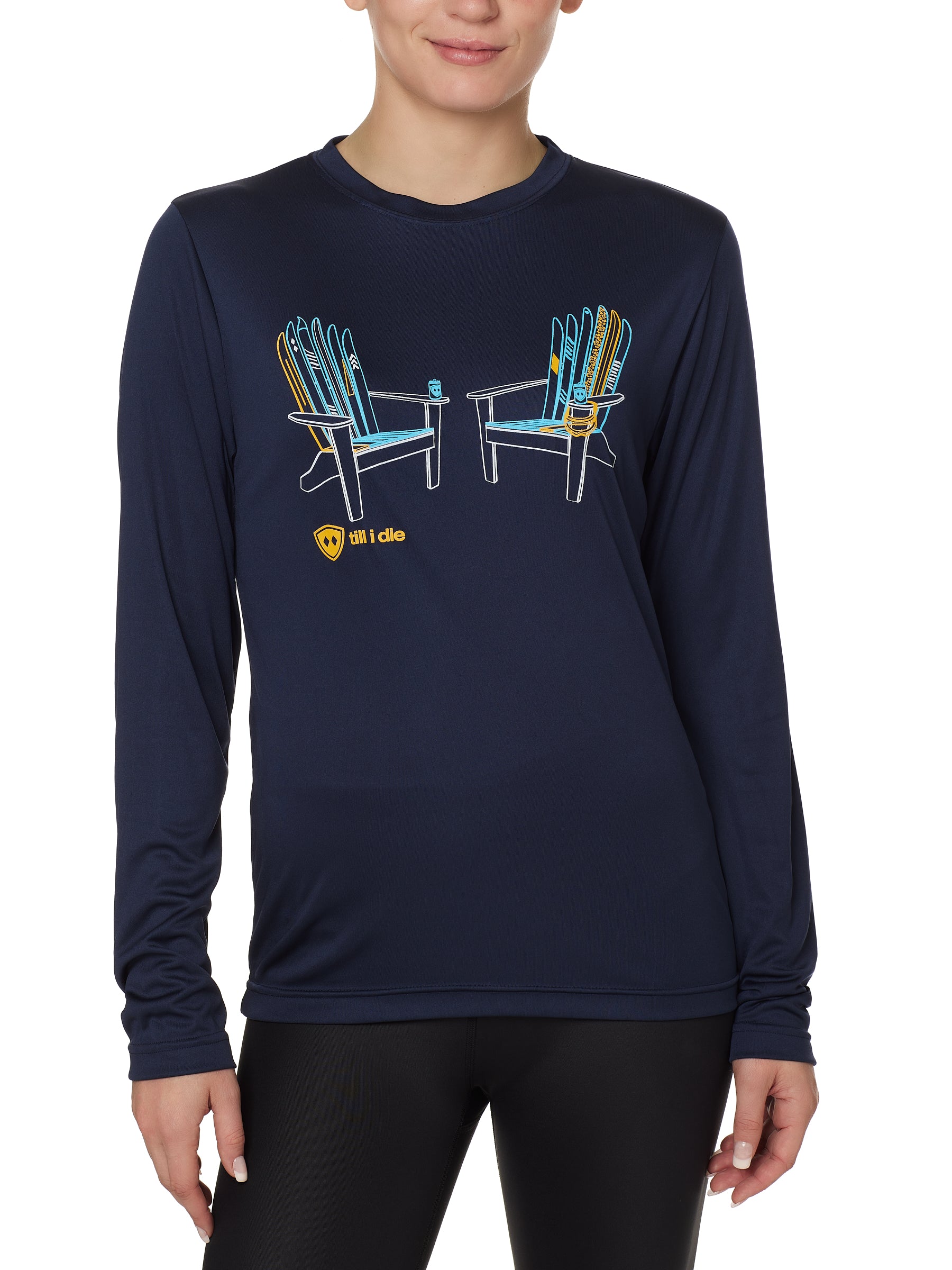 A person wearing a long sleeve navy blue shirt with a graphic of two adirondack chairs MADE OUT OF SKIS.