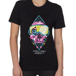 Front view of a female model wearing the Lucky 13 crew neck tee in black. The graphic features a pink skull with a cracked goggle lens revealing a wide eye, layered over a blue geometric pattern and yellow lightning bolts. “Till I Die” and “Killington, VT” text sit below the artwork.