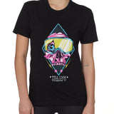 Front view of a female model wearing the Lucky 13 crew neck tee in black. The graphic features a pink skull with a cracked goggle lens revealing a wide eye, layered over a blue geometric pattern and yellow lightning bolts. “Till I Die” and “Killington, VT” text sit below the artwork.
