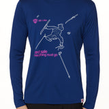 Front view of a male model wearing the Legends Yard Sale performance long sleeve shirt in blue. The graphic features a line art illustration of a skier sprawled in the snow, surrounded by scattered gear—gloves, skis, hat, and poles. Below the scene is the text: “Yard Sale – Everything Must Go.”