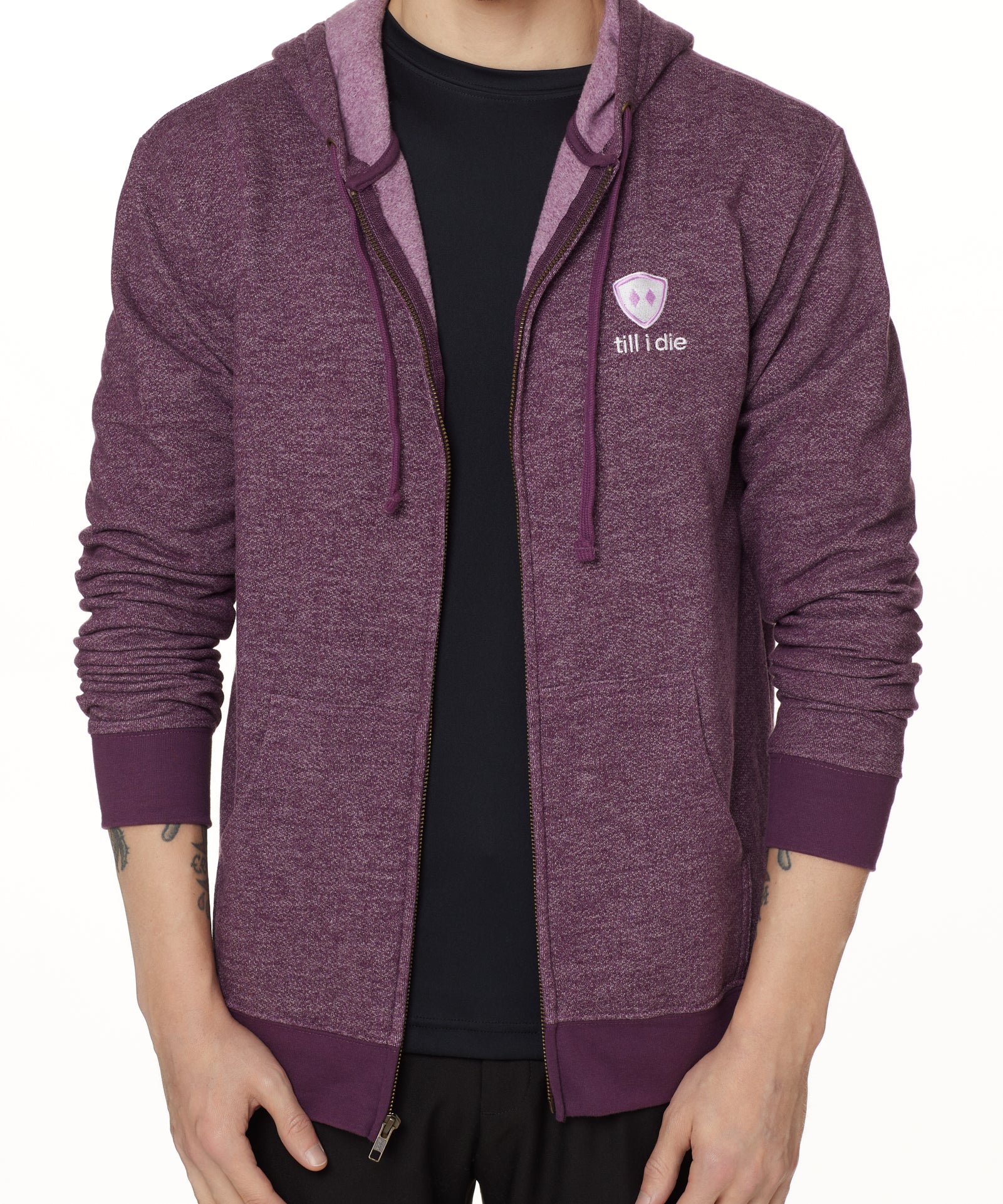 A male model wearing a HEATHER PLUM zip hoodie with the Till I Die brand logo on the front.