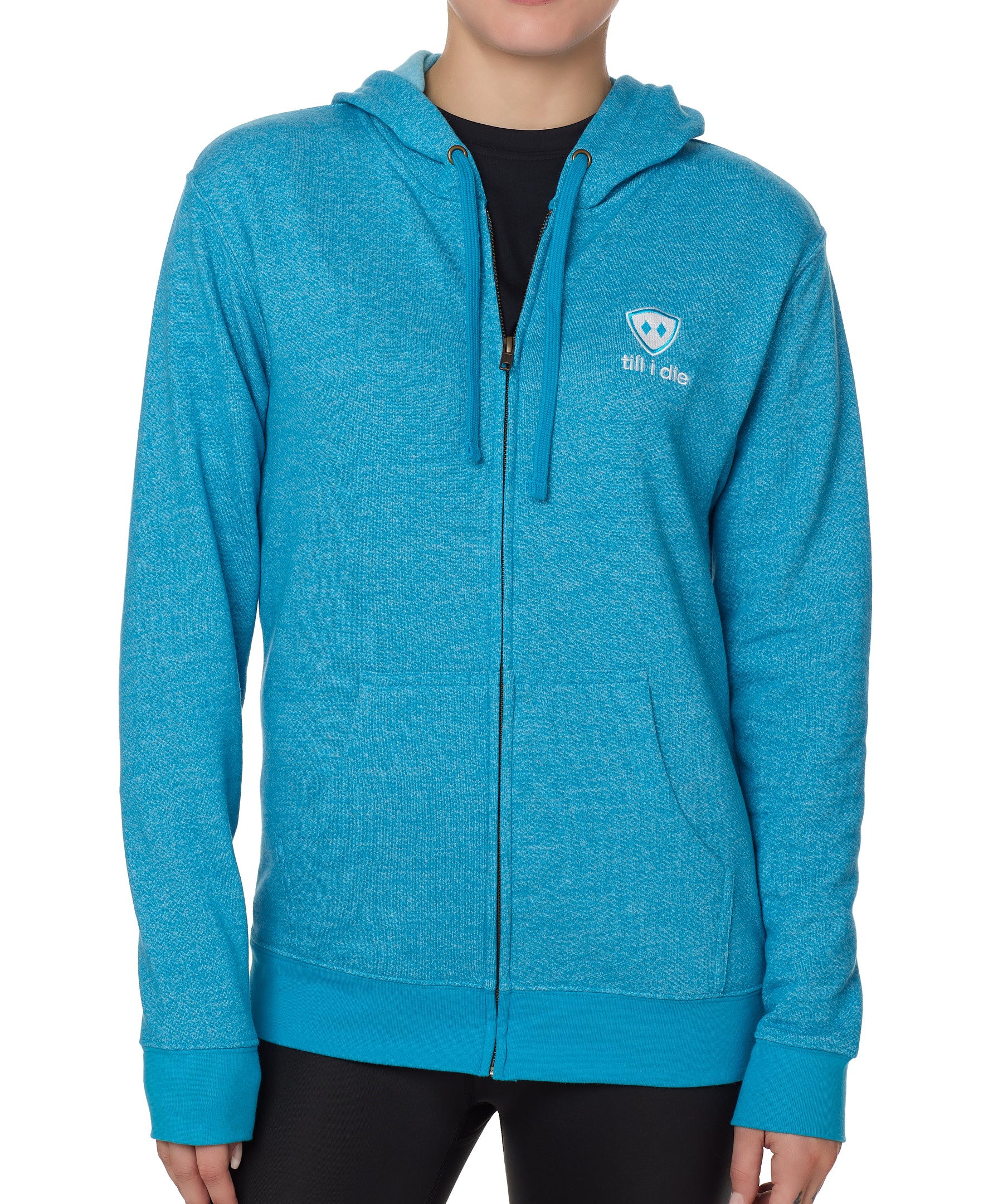 FEMALE MODEL WEARING A HEATHER TEAL ZIP HOODIE WITH THE TILL I DIE LOGO EMBROIDERED IN WHITE AND TEAL ON THE FRONT