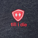 DETAIL OF A HEATHER NAVY HOODIE WITH THE TILL I DIE LOGO EMBROIDERED IN WHITE AND PINK 