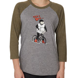 Front view of a female model wearing the Two Dollars Raglan 3/4 sleeve tee. The shirt features military green sleeves and a heather gray body, with a graphic of a ski biker in a full-face helmet. Above the illustration is “Till I Die…” text.
