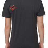 back view of a female wearing a heather slate crew neck tee shirt with a red bubble letter 'till i die'' of wearers top left shoulder 