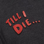 detail of red bubble letters 'till i die' on a heather slate tee