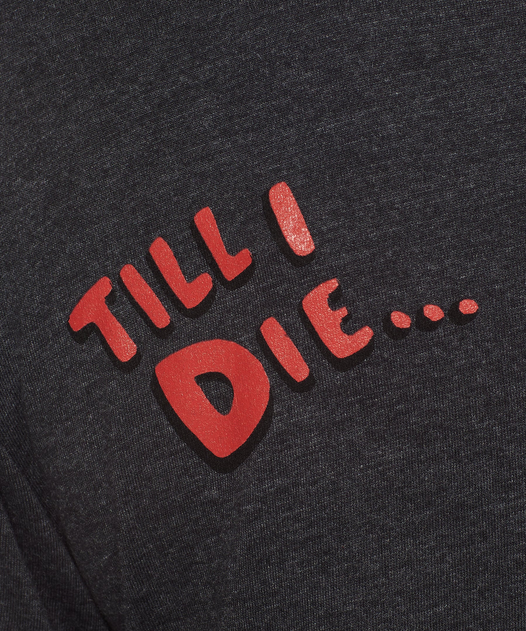 detail of red bubble letters 'till i die' on a heather slate tee