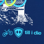DETAIL OF A BLUE PERFORMANCE SHIRT WITH a light blue TILL I DIE LOGO AND BIKE GRAPHIC