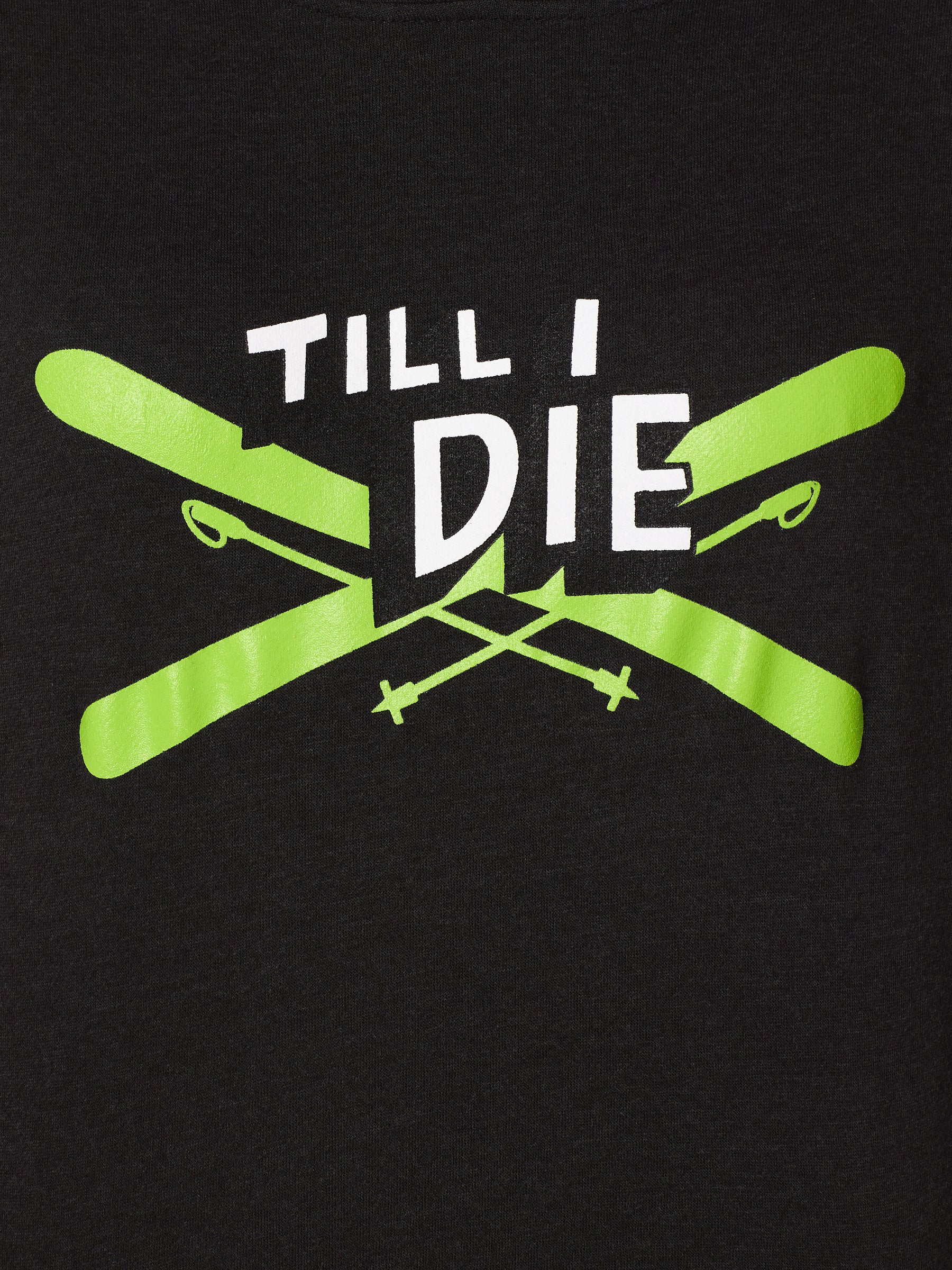 close up detail of the iron cross hoodie, the graphic features lime green crossed skis with poles, overlaid with bold black and white “Till I Die” text for a striking, alpine-inspired statement.