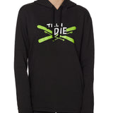 Front view of a male model wearing the Iron Cross hoodie in heather black, displayed on a white background. The graphic features lime green crossed skis with poles, overlaid with bold black and white “Till I Die” text for a striking, alpine-inspired statement.
