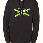 Front view of a male model wearing the Iron Cross hoodie in heather black, displayed on a white background. The graphic features lime green crossed skis with poles, overlaid with bold black and white “Till I Die” text for a striking, alpine-inspired statement.