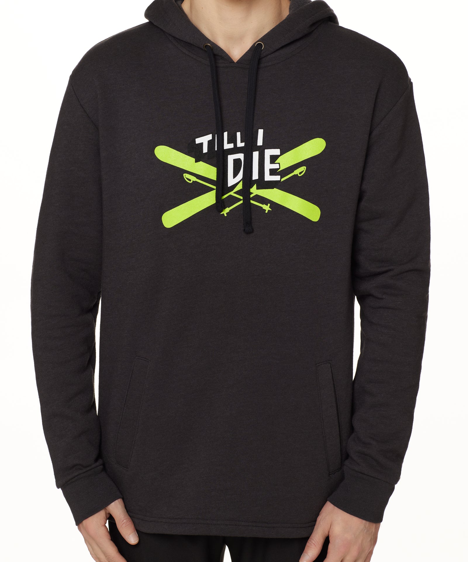 Front view of a male model wearing the Iron Cross hoodie in heather black, displayed on a white background. The graphic features lime green crossed skis with poles, overlaid with bold black and white “Till I Die” text for a striking, alpine-inspired statement.