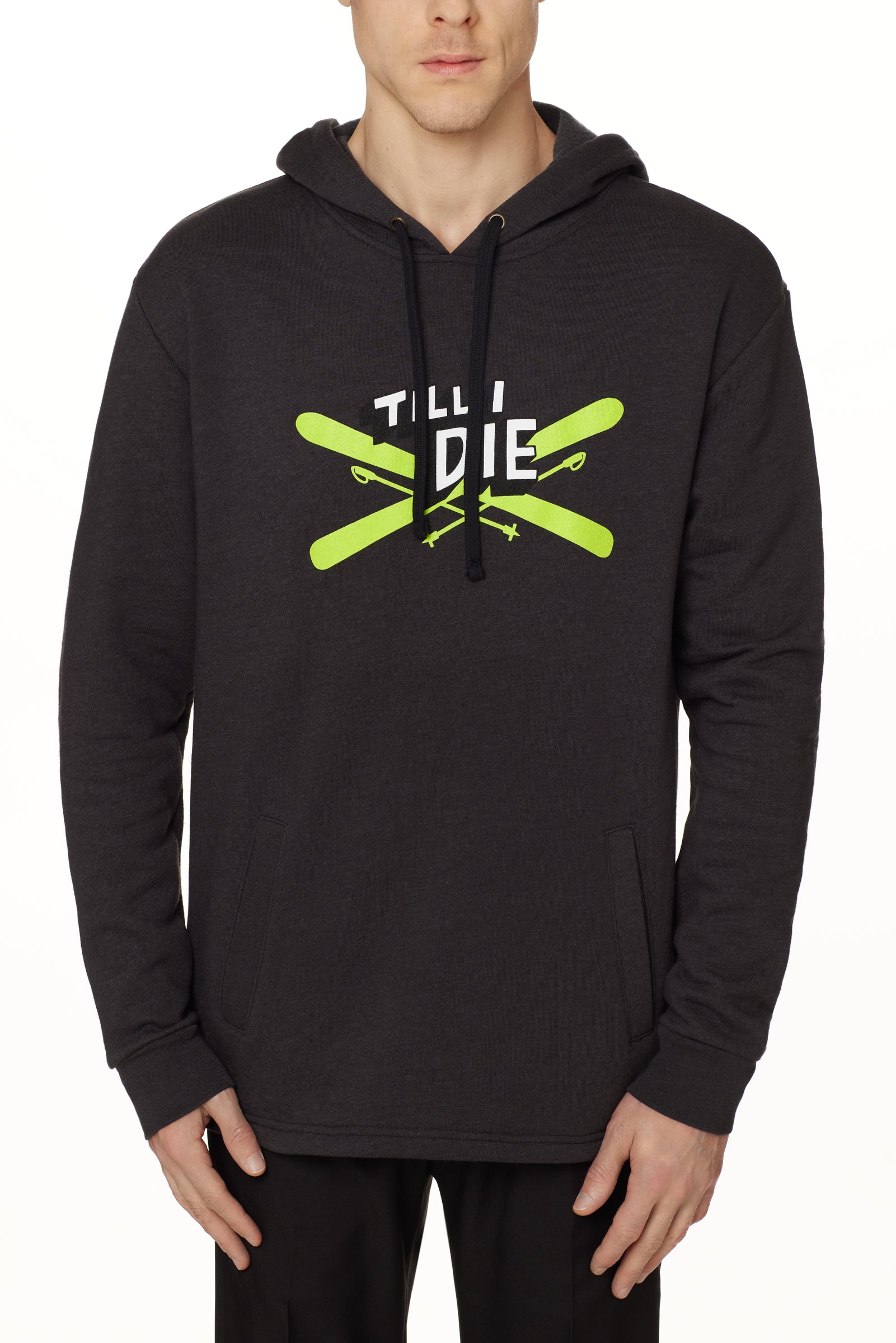 Front view of a male model wearing the Iron Cross hoodie in heather black, displayed on a white background. The graphic features lime green crossed skis with poles, overlaid with bold black and white “Till I Die” text for a striking, alpine-inspired statement.