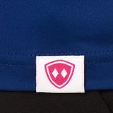 DETAIL OF A BLUE SHIRT WITH THE TILL I DIE SHIELD WOVEN HEM TAG