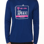 MALE MODEL WEARING A BLUE PERFORMANCE LONG SLEEVE SHIRT WITH A GRAPHIC OF AN OLD SKI DAY PASS