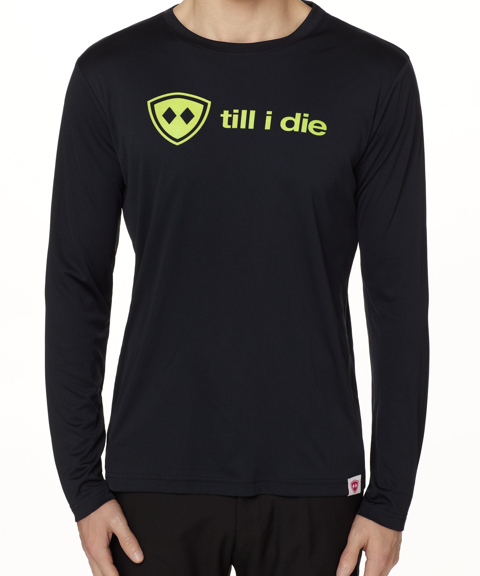 front view of a male model wearing a black long sleeve tee with a bright yellow till i die logo on a white background