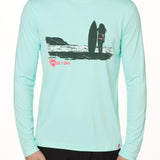 Front view of a male model wearing the Surf Girl long sleeve performance shirt in mint, shown on a white background. The graphic depicts a silhouetted female surfer standing with her board, gazing out at the ocean surf, with a hot pink “Till I Die” logo below the artwork.