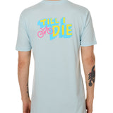 Back view of a male model wearing the Bike till i die tee shirt in light blue on a white background. The graphic features a pink mountain bike layered over bold blue and yellow till i die text