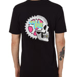 Back view of a male model wearing the Gear Head Tee in black. The back graphic features a skull with gears inside the head and overlapped by yellow and blue "Till I Die" text.