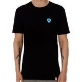 Front view of a male model wearing the Gear Head crew neck tee in black on a white background. Accented with a cyan blue double diamond shield over wearers left chest.