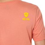 Back view of a male model wearing a sunset short sleeve shirt on a white background, featuring a yellow Till I Die logo on the wearer’s top right shoulder.