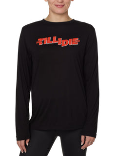 front view of a female model wearing the hot dog crew neck long sleeve tee in black. The graphic is red 'till i die' lettering inspired by the iconic title art for the 1984 ski move 'Hot Dog'
