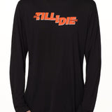 front view of a male model wearing the hot dog crew neck long sleeve tee in black. The graphic is red 'till i die' lettering inspired by the iconic title art for the 1984 ski move 'Hot Dog'