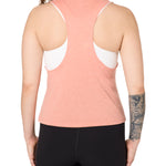 Back view of a female model wearing the Surf Truck tank in Sunset on a white background. 