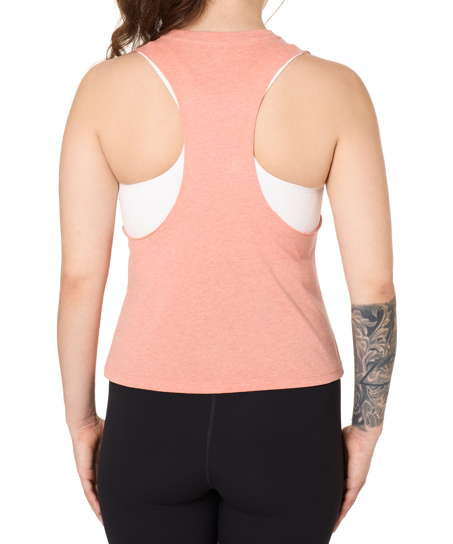 Back view of a female model wearing the Surf Truck tank in Sunset on a white background. 