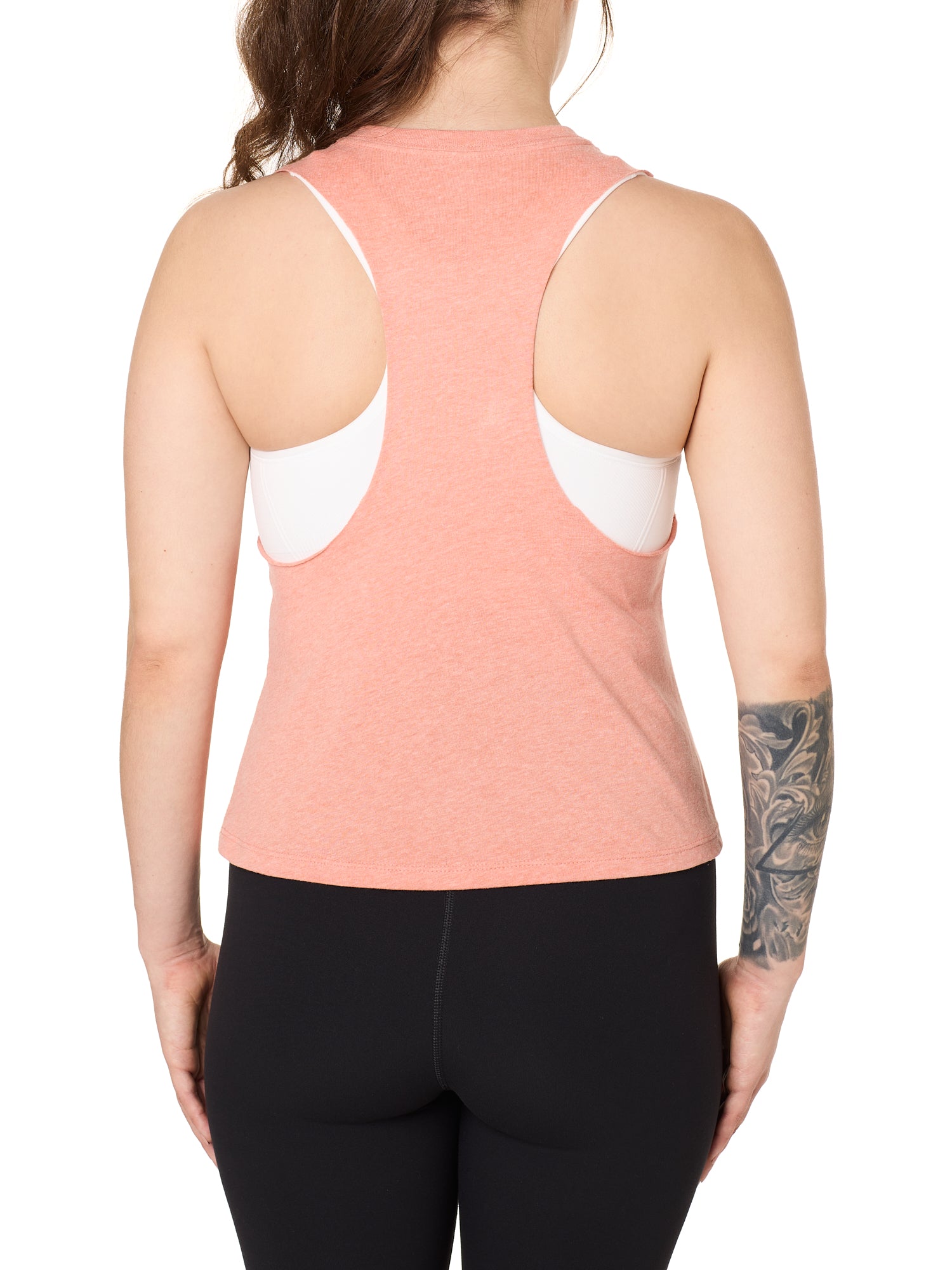 Back view of a female model wearing the Surf Truck tank in Sunset on a white background. 