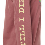 Sleeve detail of the surf truck long sleeve tee featuring yellow 'till i die' text down the arm