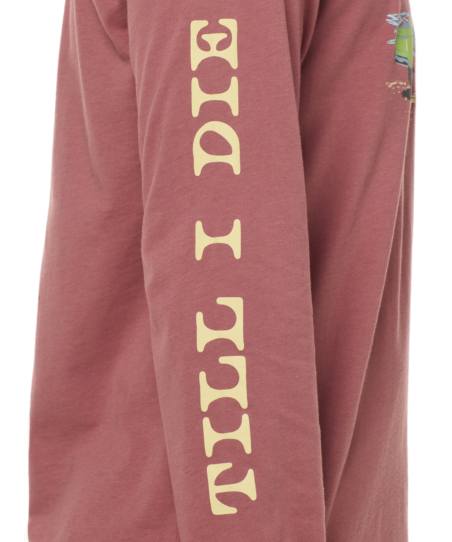 Sleeve detail of the surf truck long sleeve tee featuring yellow 'till i die' text down the arm