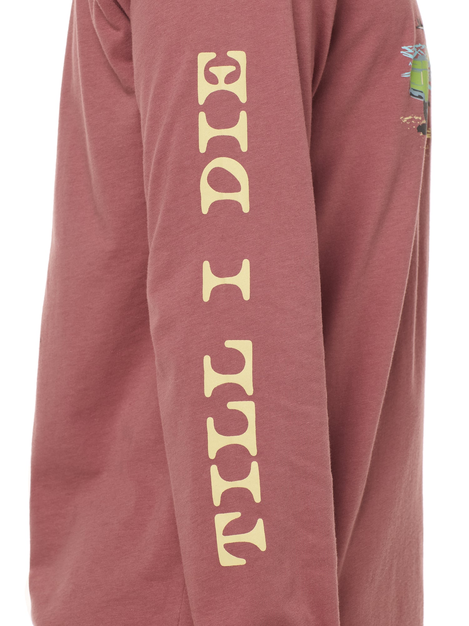 Sleeve detail of the surf truck long sleeve tee featuring yellow 'till i die' text down the arm