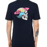Back view of a male model wearing the Skull Wave Head Tee in navy. The back graphic features a skull with a wave inside the head, overlapped by a pink surfboard and accented with yellow and blue "Till I Die" text.