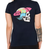 Back view of a female model wearing the Skull Wave Head Tee in navy. The back graphic features a skull with a wave inside the head, overlapped by a pink surfboard and accented with yellow and blue "Till I Die" text.